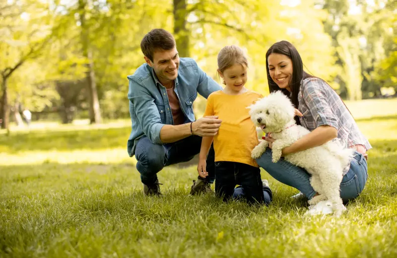 family outside with dog